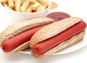 Saveloys in bread bun with chips