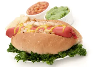 Saveloy in bread bun with mustard